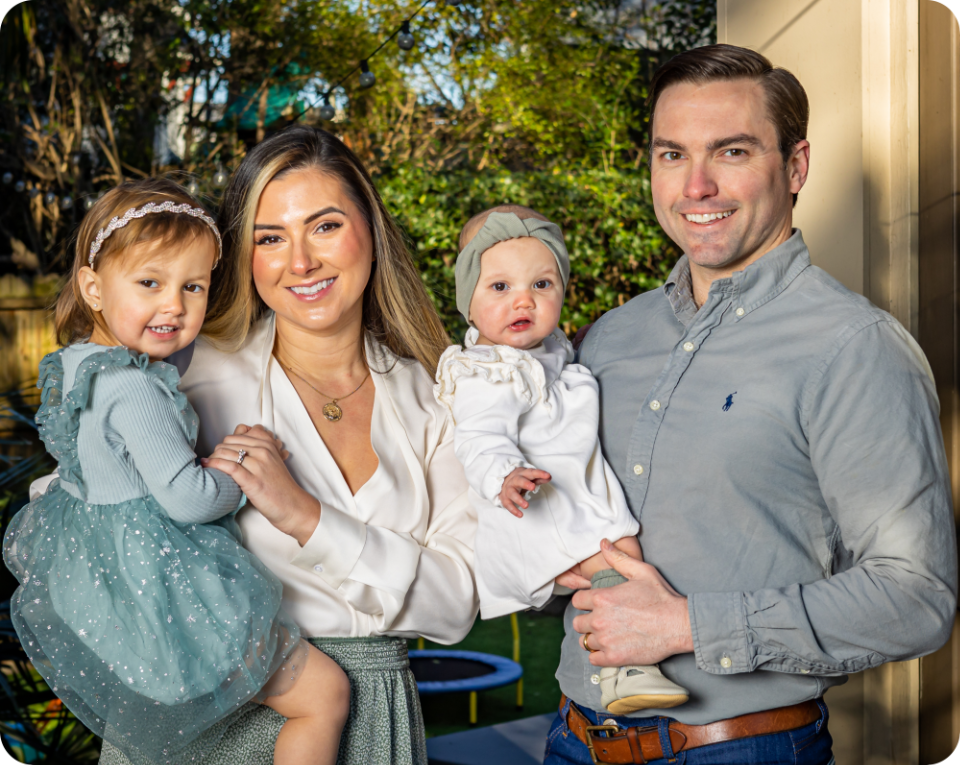 Alyssa Whatley smiling with her family