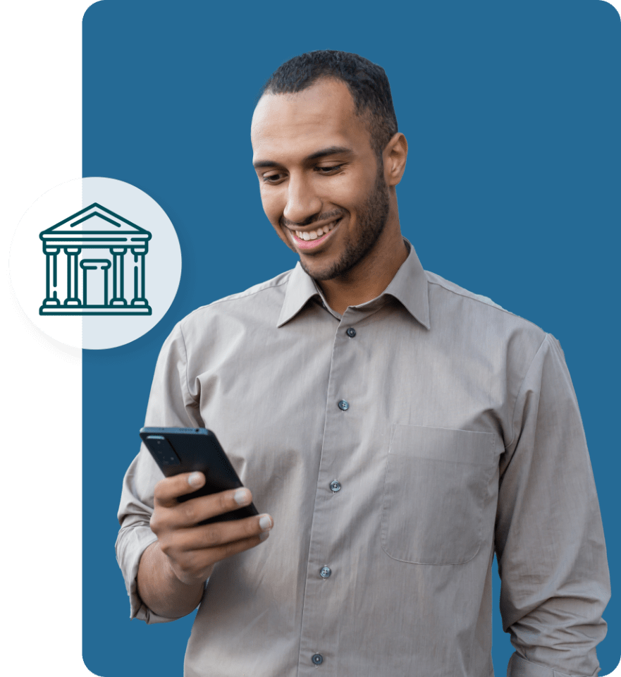 Young man smiling holding phone