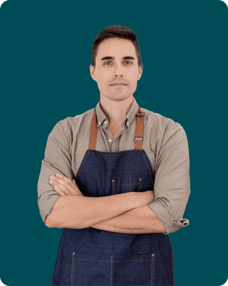 Young man posing and standing firm in an apron