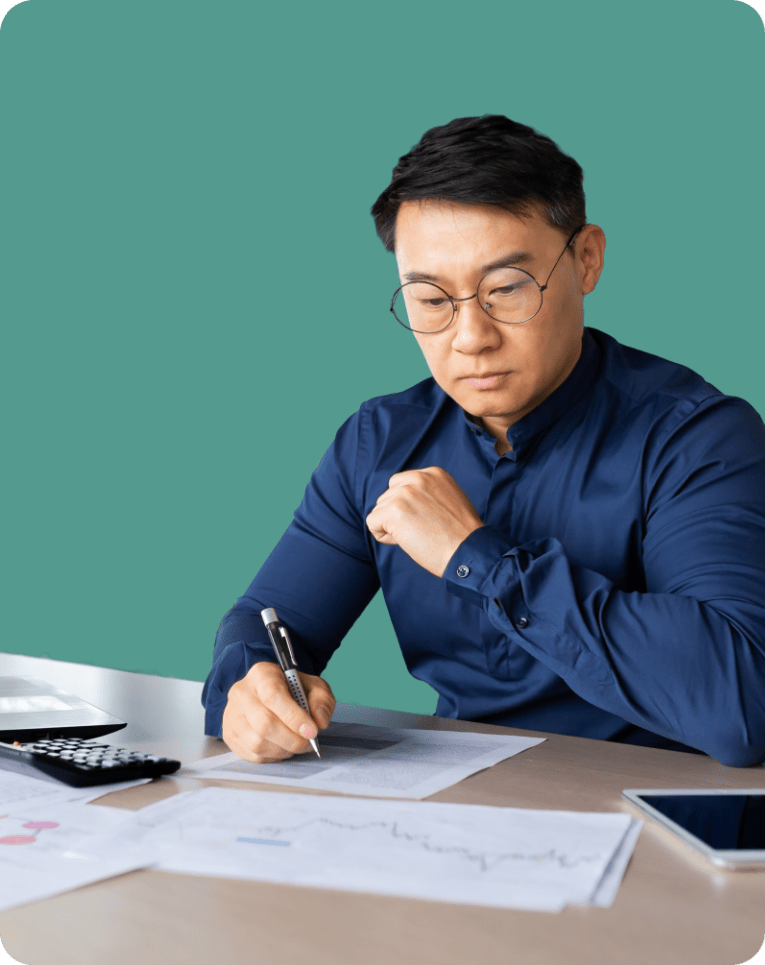 Middle age man calculating back taxes