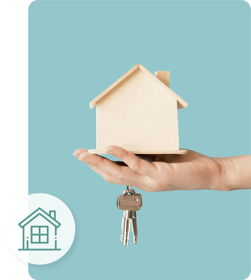 A hand holding a house and keys
