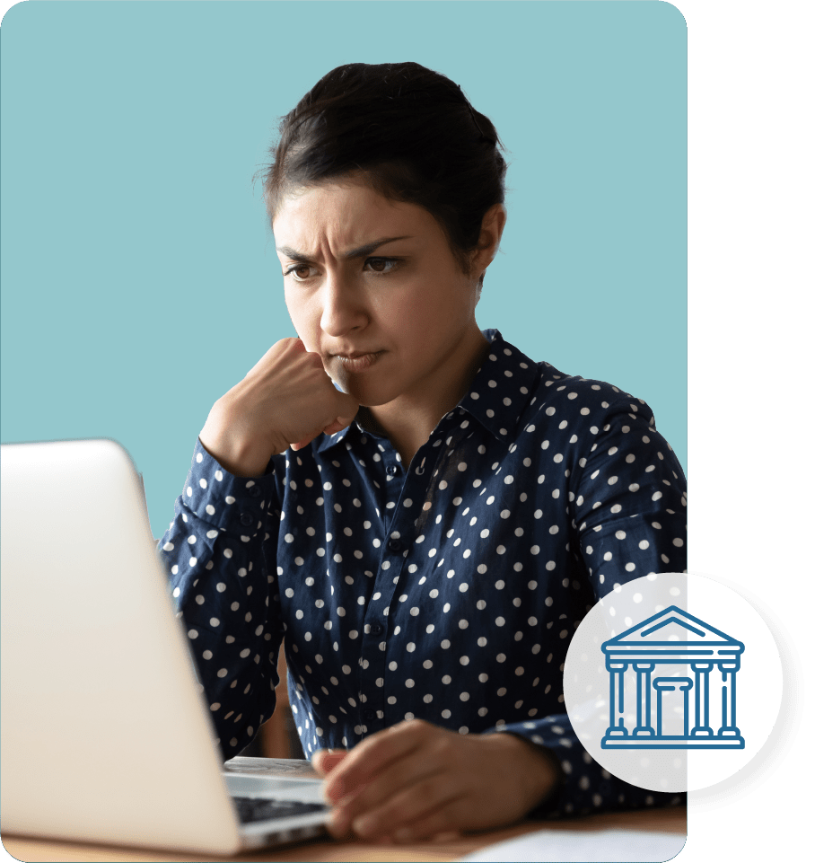A concerned woman reading on her laptop