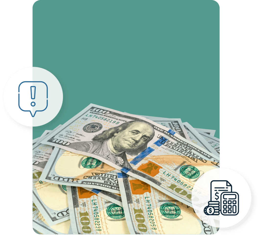 100 dollar bills piled on the floor