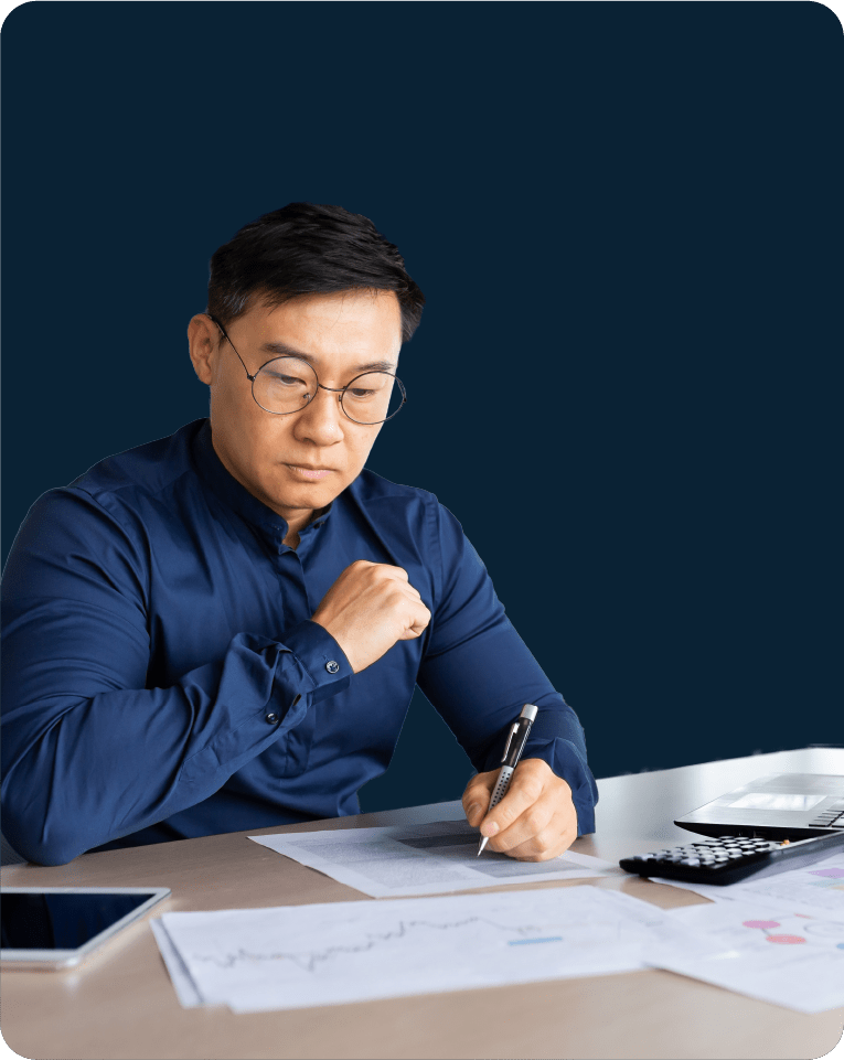 A man reviewing his taxes by hand